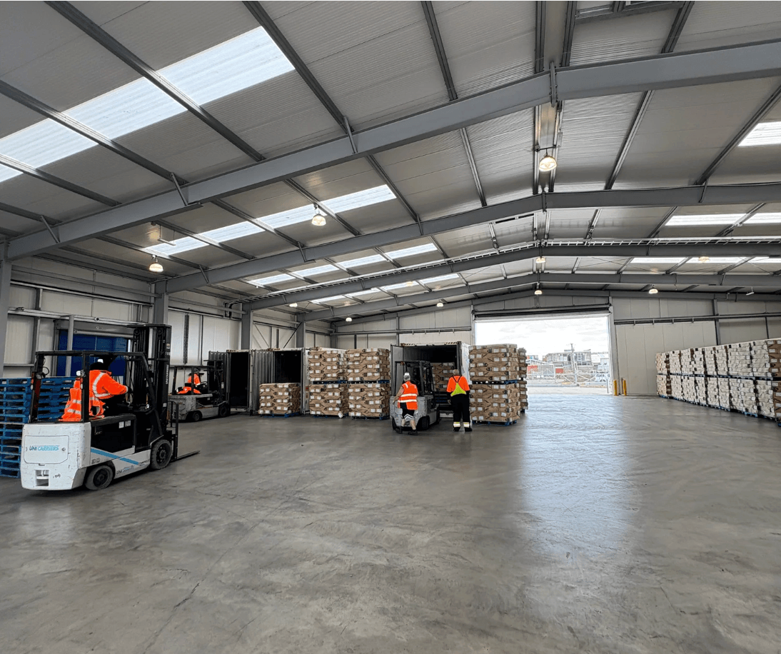 Warehouse interior with forklifts